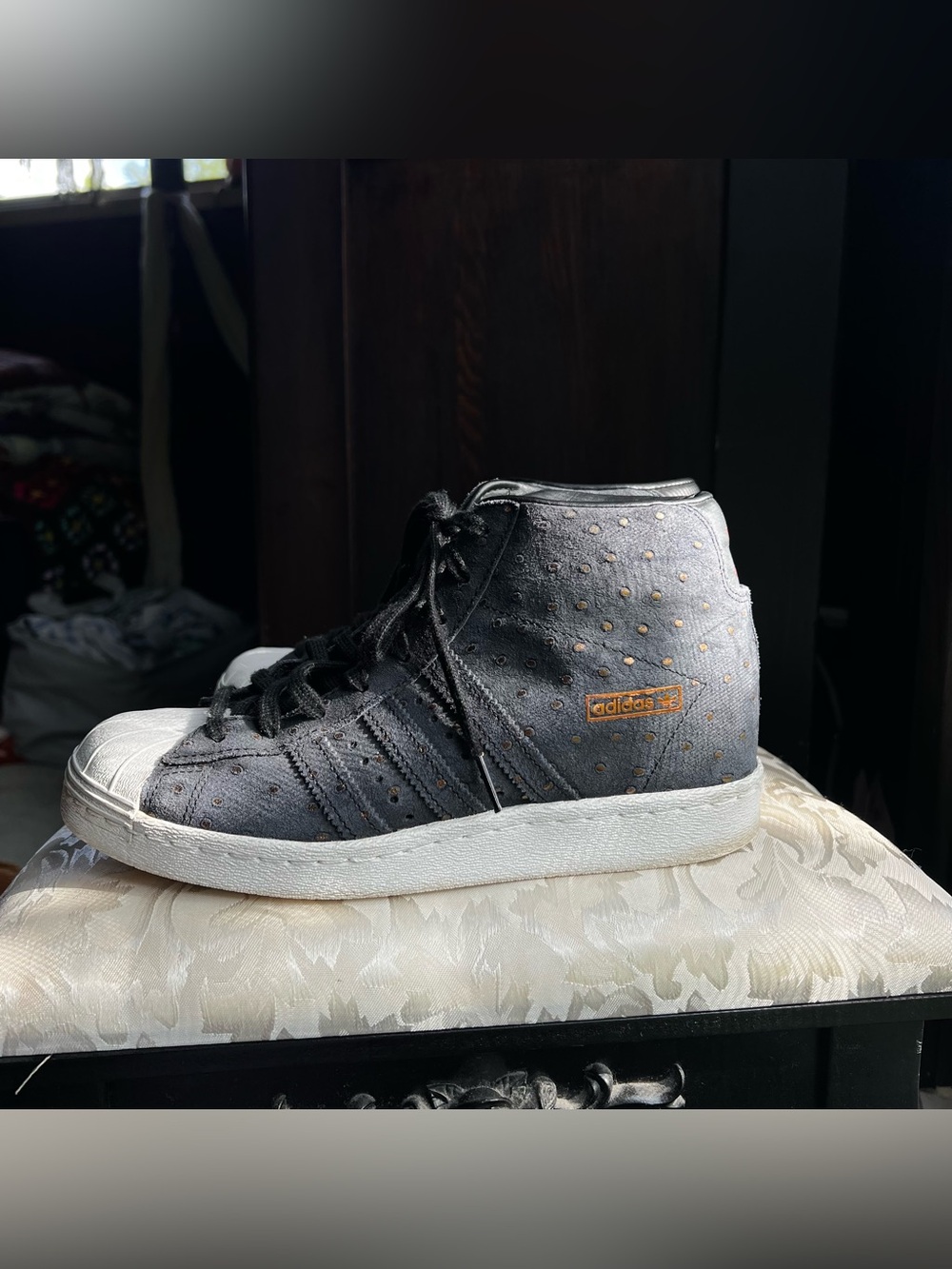 adidas Superstar Black High-Top Sneaker with Gold Accents